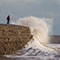 huge wave washes over The Cobb at Lyme Regis